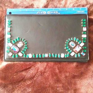 Bebe black leather jeweled clutch. Few indent marks but in like new condition.